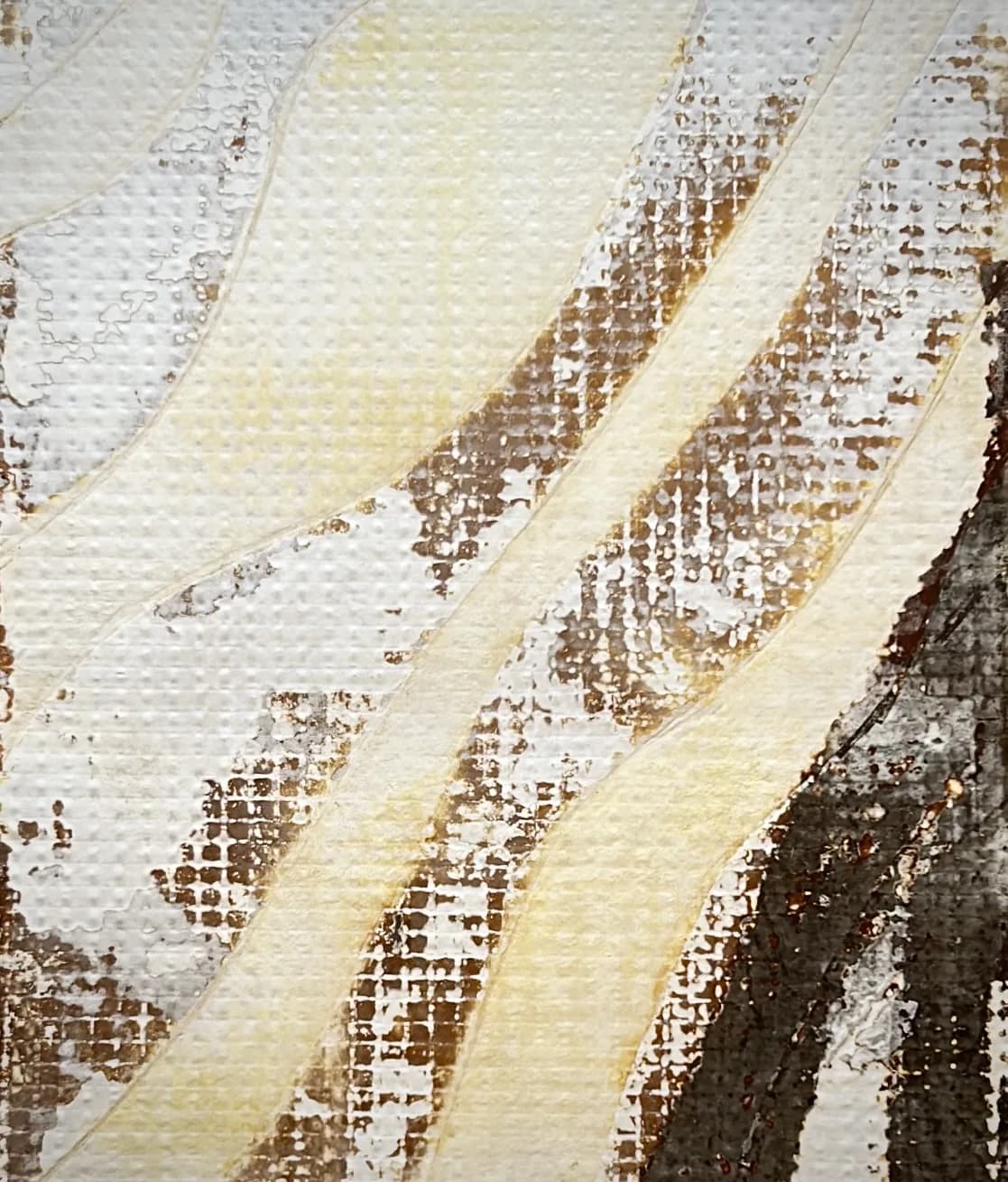 Close-up of a surface printed with a fine rust-brown grid texture, crossed by wavy cream bands.